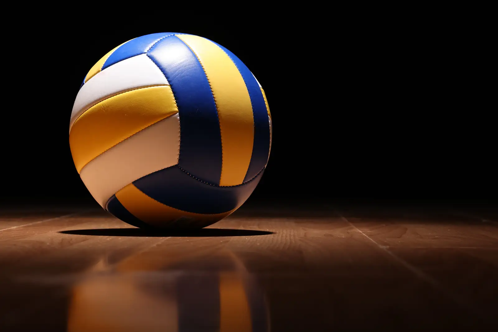 Volleyball on a polished wooden court